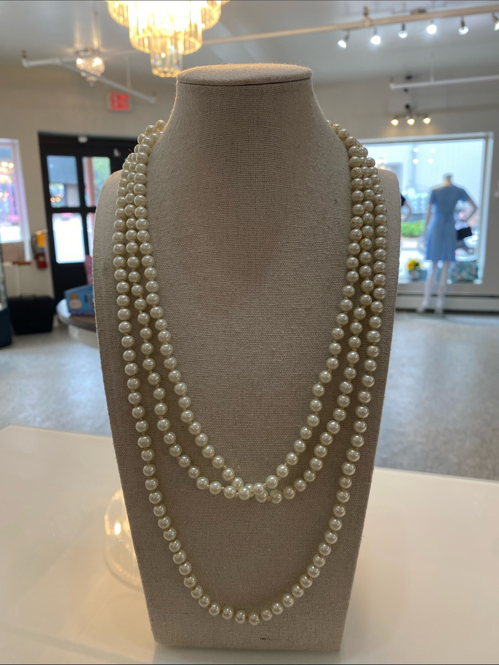 One long glass hand knotted pearl necklace